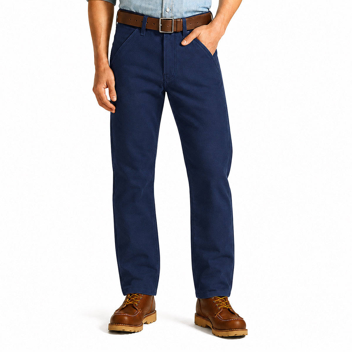 A person wearing navy blue straight-leg work pants, a brown leather belt, a light blue shirt, and brown lace-up boots, shown from the waist down on a white studio background.